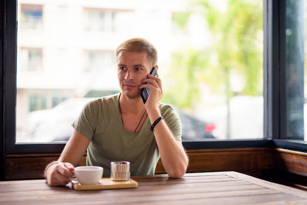 Portrait of handsome man relaxing in the coffee shop