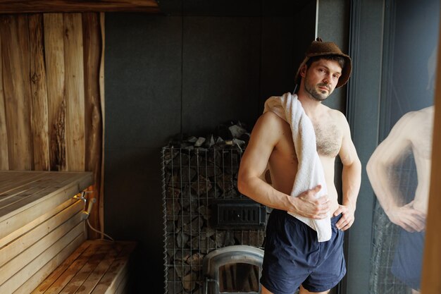 Portrait of handsome man in sauna