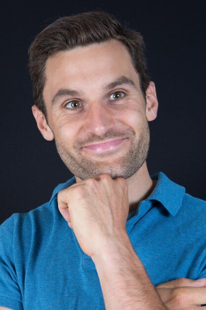 Portrait of a handsome man smiling - indoors