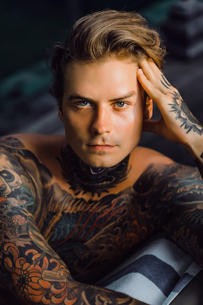 Portrait of a handsome man in tattoos