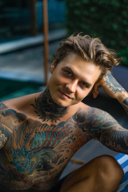 Portrait of a handsome man in tattoos