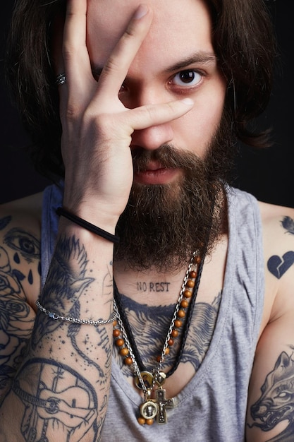 Portrait of handsome man with beard and tattoo