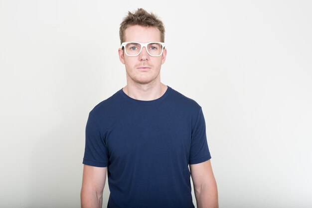 Portrait of handsome man with eyeglasses looking at camera