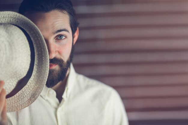 Portrait of handsome man with hat