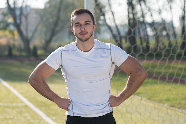 Portrait Of a Handsome Personal Trainer in City Park Area  Training and Exercising for Endurance  Healthy Lifestyle Concept Outdoor