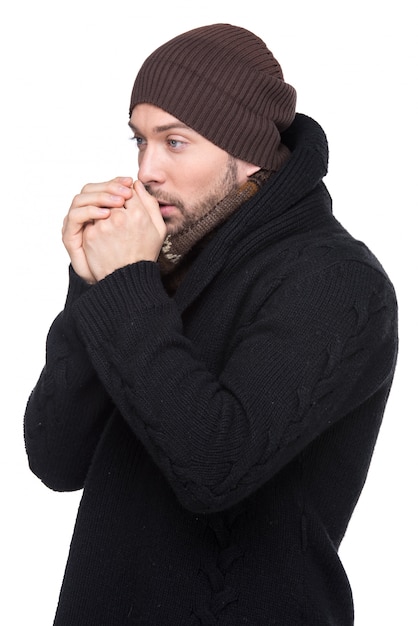 Portrait of handsome sick man in cap and scarf.