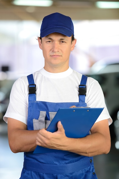 Portrait of handsome smiling mechanic man