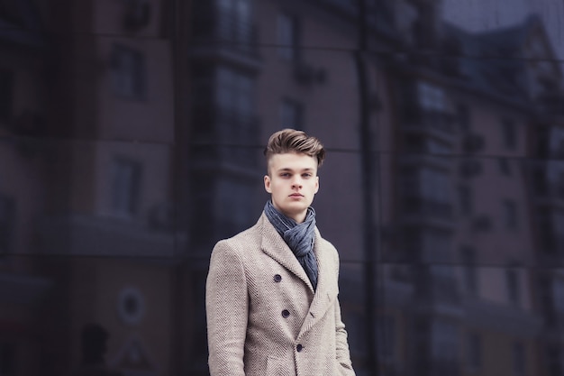 Portrait handsome stylish man in elegant coat