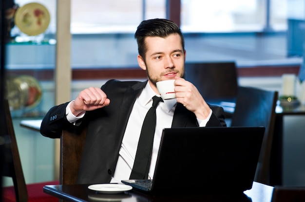 Portrait of a handsome yang businessman in office.