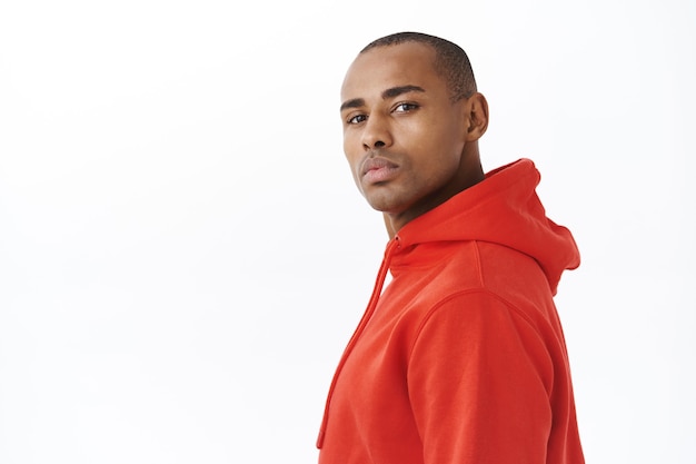 Portrait of handsome young african-american man standing in profile