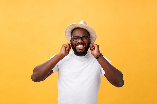 Portrait of handsome young african guy smiling in white t-shirt