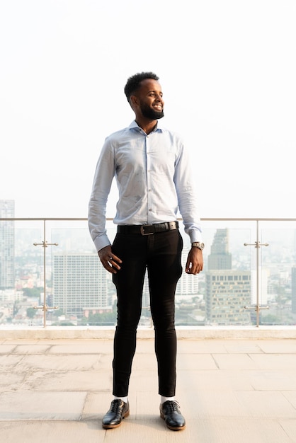 Portrait of handsome young african man full length shot