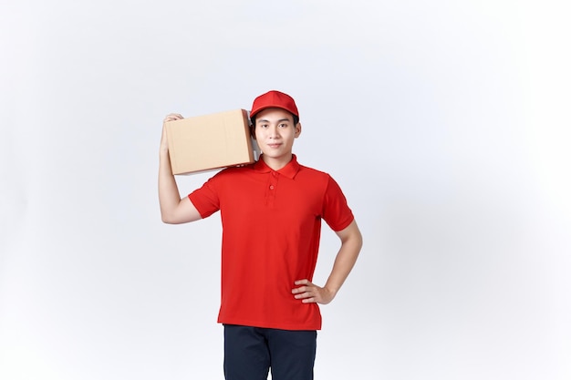 Portrait of a handsome young man holding card boxes isolated on white