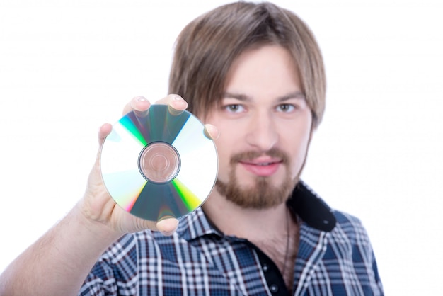 Portrait of a handsome young man holding cd.