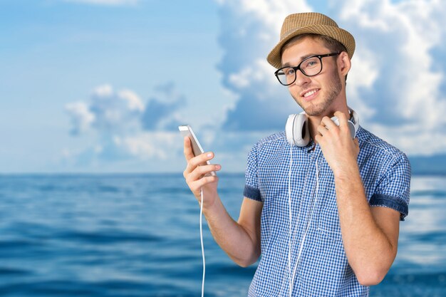 Portrait of handsome young man listening to music