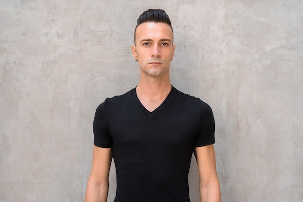 Portrait of handsome young man with undercut wearing black t-shirt