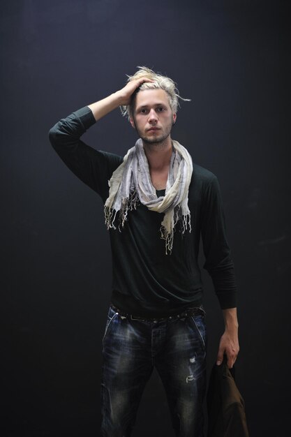 Portrait of an handsome young  man  with urban background and fashion clothes style