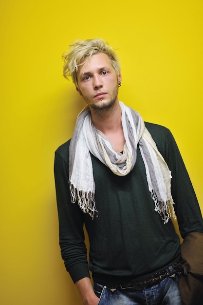 Photo portrait of an handsome young  man  with urban background and fashion clothes style