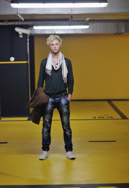 Portrait of an handsome young man with urban background and fashion clothes style