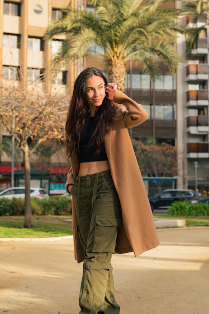 Portrait of a happiness young woman looking at the camera on the street