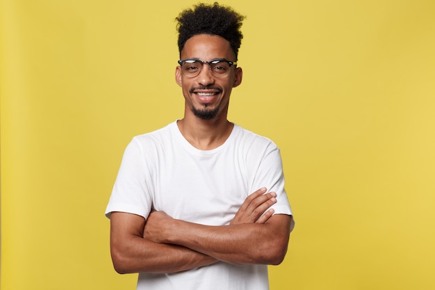 portrait of a happy african american man posing with arms crossed 