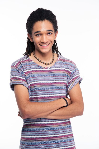 Portrait of a happy afro american man standing with arms folded isolated on a white wall