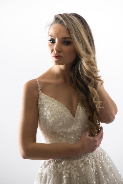 Portrait of happy beautiful bride on white background