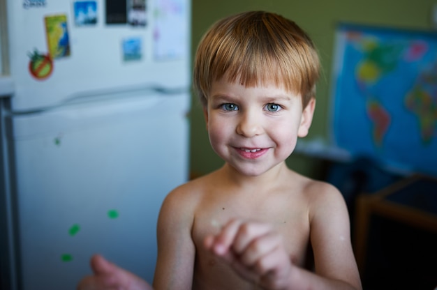 Portrait of a happy boy having fun at home