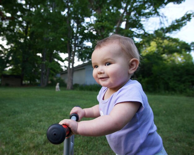 Portrait of happy boy playing in park