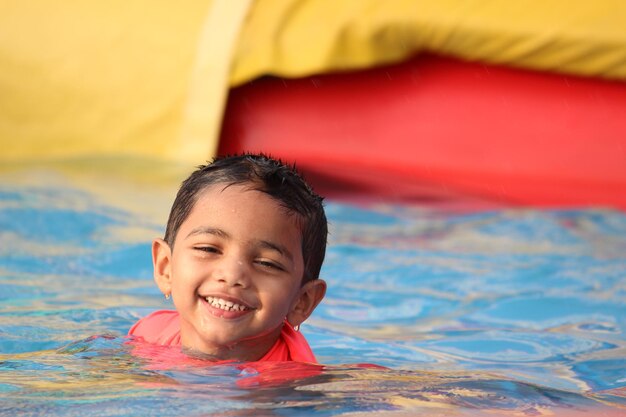 Portrait of happy boy in swimming pool