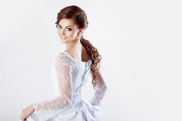 Portrait of happy bride in wedding dress