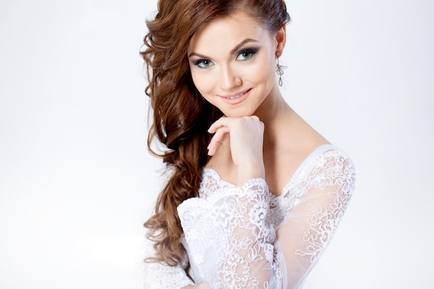Portrait of happy bride in wedding dress