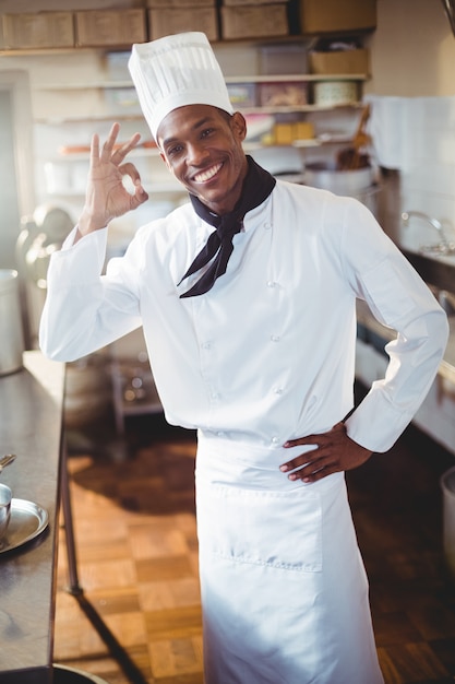 Portrait of happy chef making ok sign