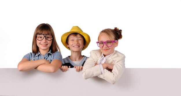 Portrait of happy children with white blank