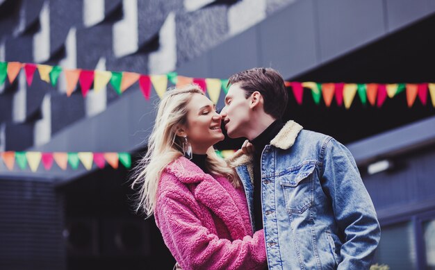 Portrait of a happy couple in european city in valentine day