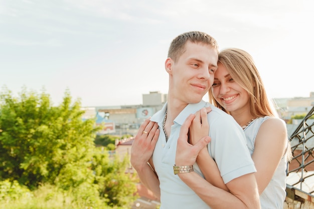 Portrait of Happy Couple Hugging Laughing