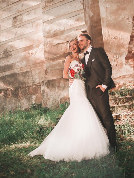 Portrait of a happy couple in love on the background of an old manor