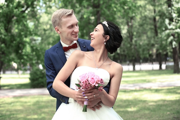 Portrait of happy couple on nature background