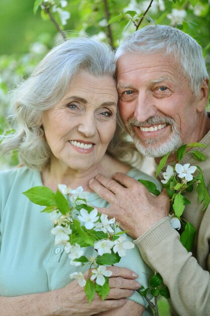 Portrait of happy couple posing in park