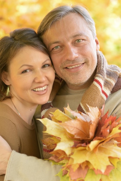 Portrait of happy couple posing in park