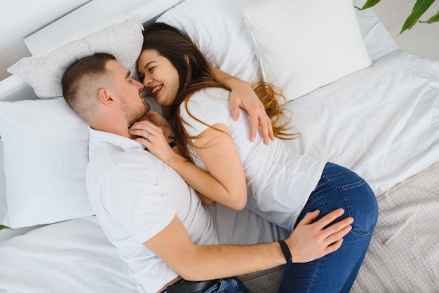 Portrait of happy couple relaxing at home