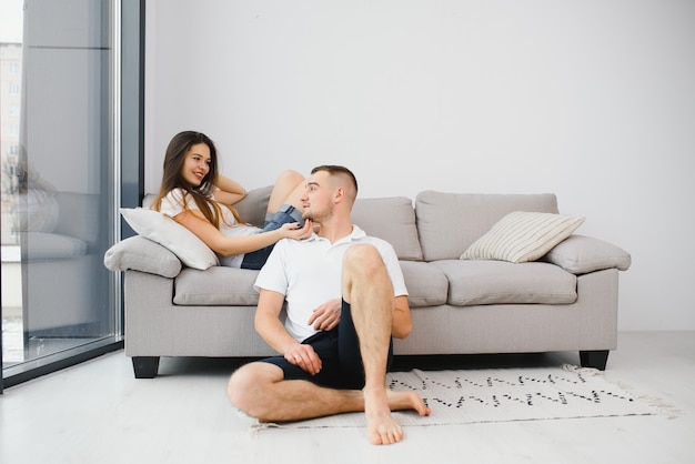 Portrait of happy couple relaxing at home