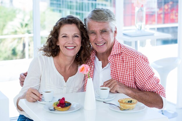 Portrait of happy couple at restaurant