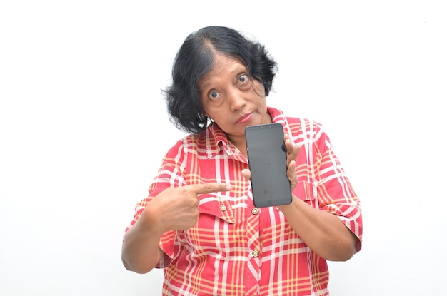 Portrait of happy ecstatic senior asian woman holding and showing phone screen