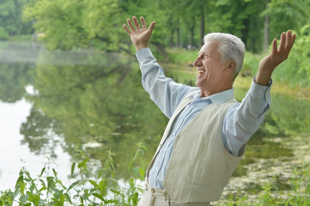 Portrait of a happy elderly man outdoors