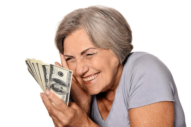 Portrait of happy elderly woman with dollars