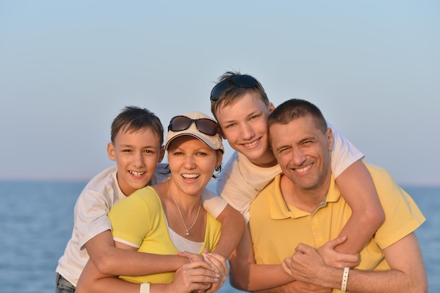 Portrait of a happy family at beach in summer