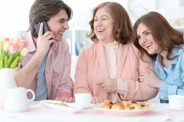 Portrait of a happy family drinking tea together