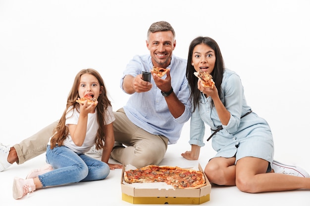 Portrait of a happy family eating pizza