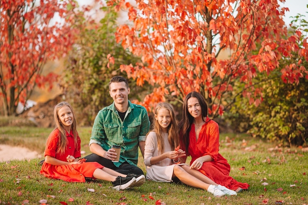 Portrait of happy family of four in autumn